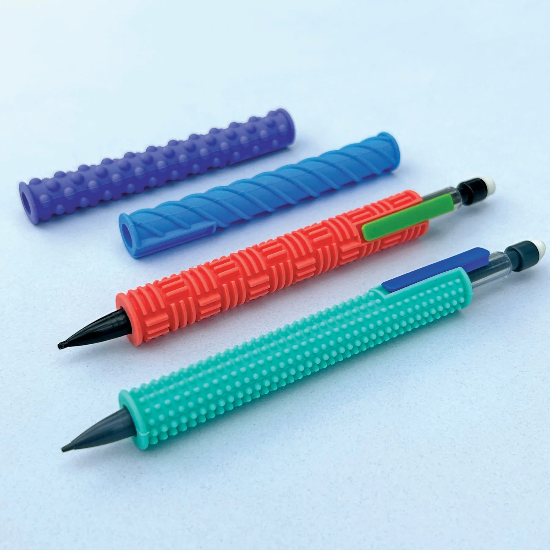 4 colorful silicone pencil gidgets and 2 mechanical pencils