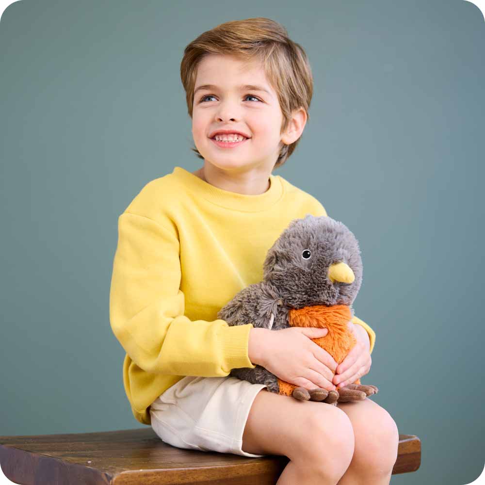 robin sitting on lap of young boy, almost reaches shoulder height