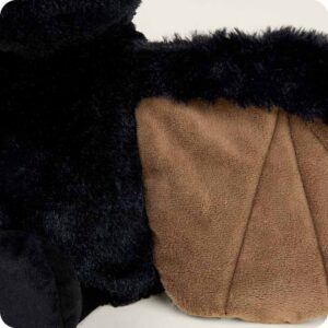 close up of mid length black fur on body and shorter brown fur inside wing with zig zag stitching