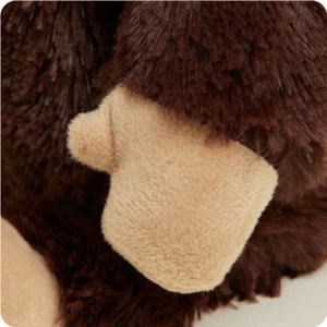 mid length dark brown body fur and close up on hand with shorter tan fur and thumb