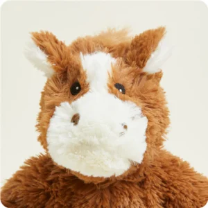 close up of face shows cream fur on nose and in between eyes and inside of ears