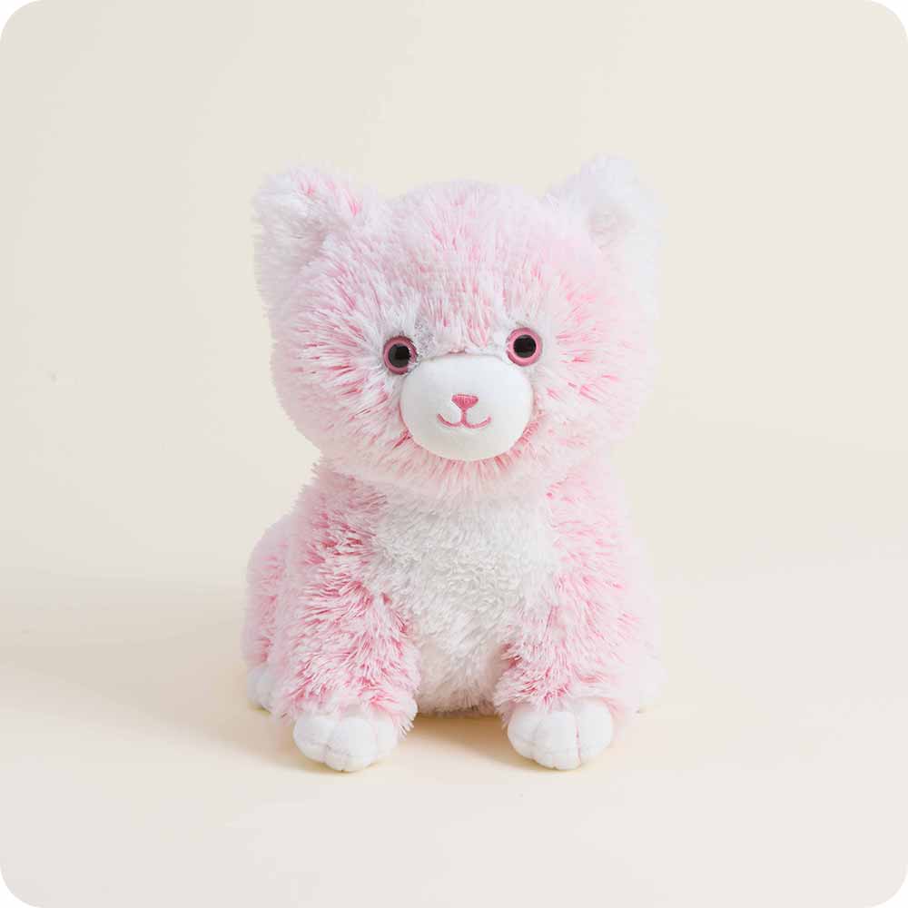 pink kitten stuffie with shorter white fur at nose, belly and feet