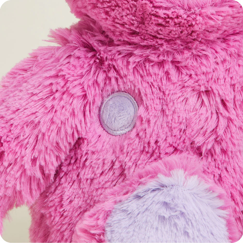 close up of mid length pink fur, shorter fur spot with satin stitch around it