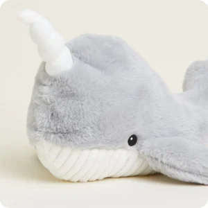 close up of narwhal's head, with cream horn coming from its forehead
