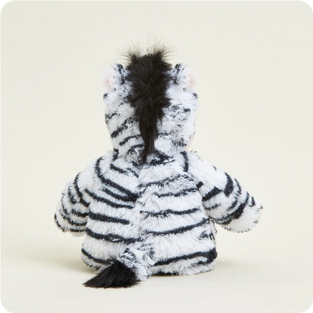 back of zebra shows black mane and black tip of tail