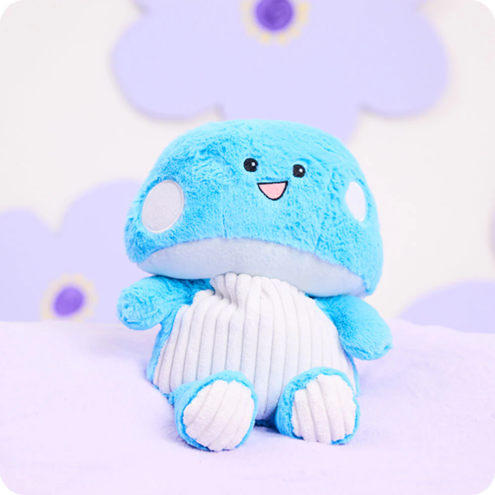 mushroom stuffie seated on lavender pillow with flowers in the background