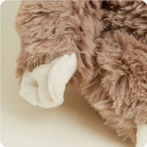 close up of mid length tan body fur and short cream fur scalloped shaped hands
