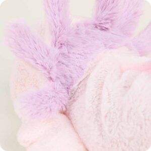 close up with shorter pink fur on body and longer purple fur behind gills
