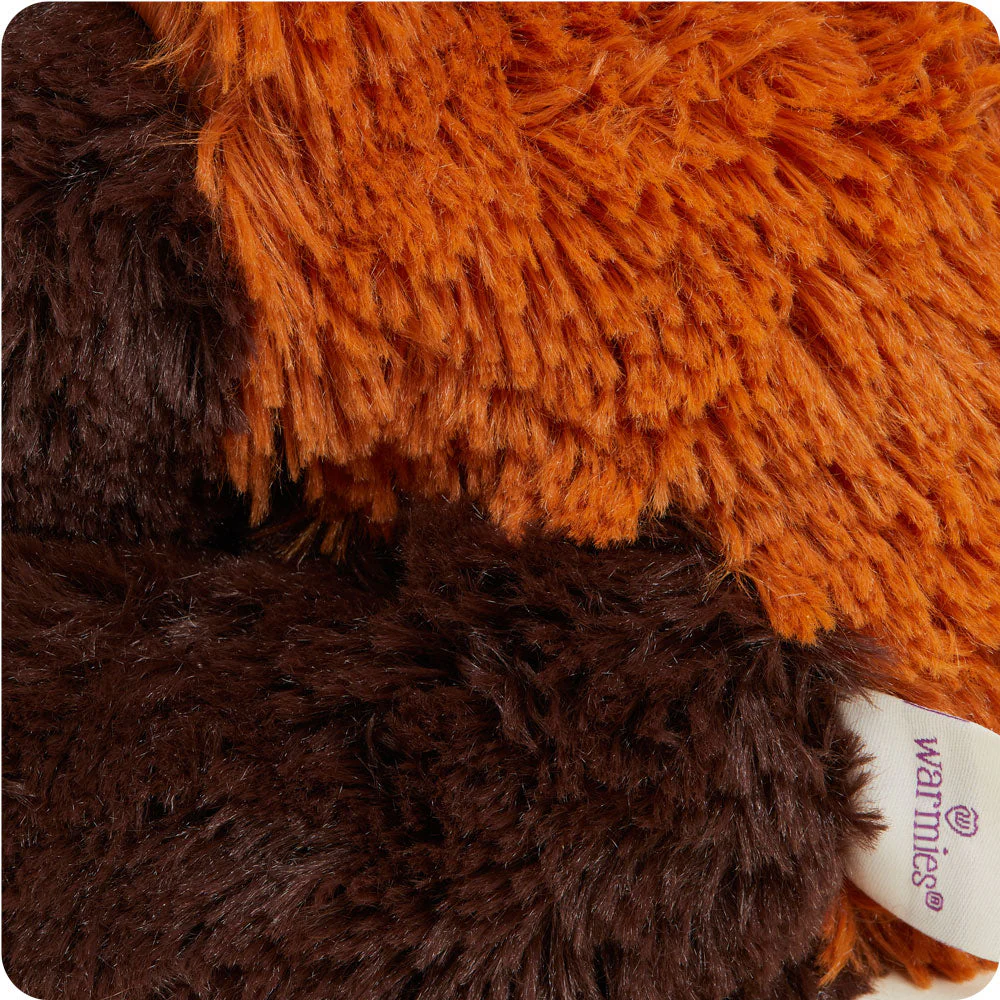 close up of mid length fur in burnt orange and dark brown