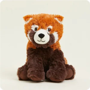 red panda stuffie has burnt orange head and shoulders, brown body and legs, white patches on face and near ears