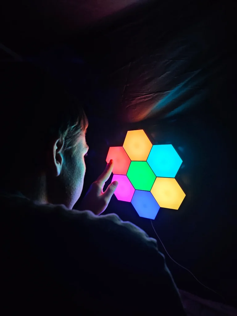 7 colored hexagons shine in different colors in the dark