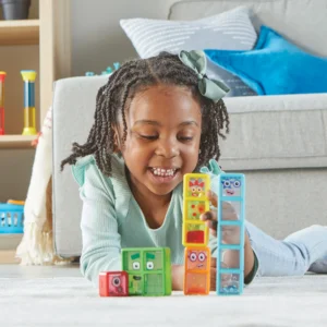 girl on carpet playing with numberblocks
