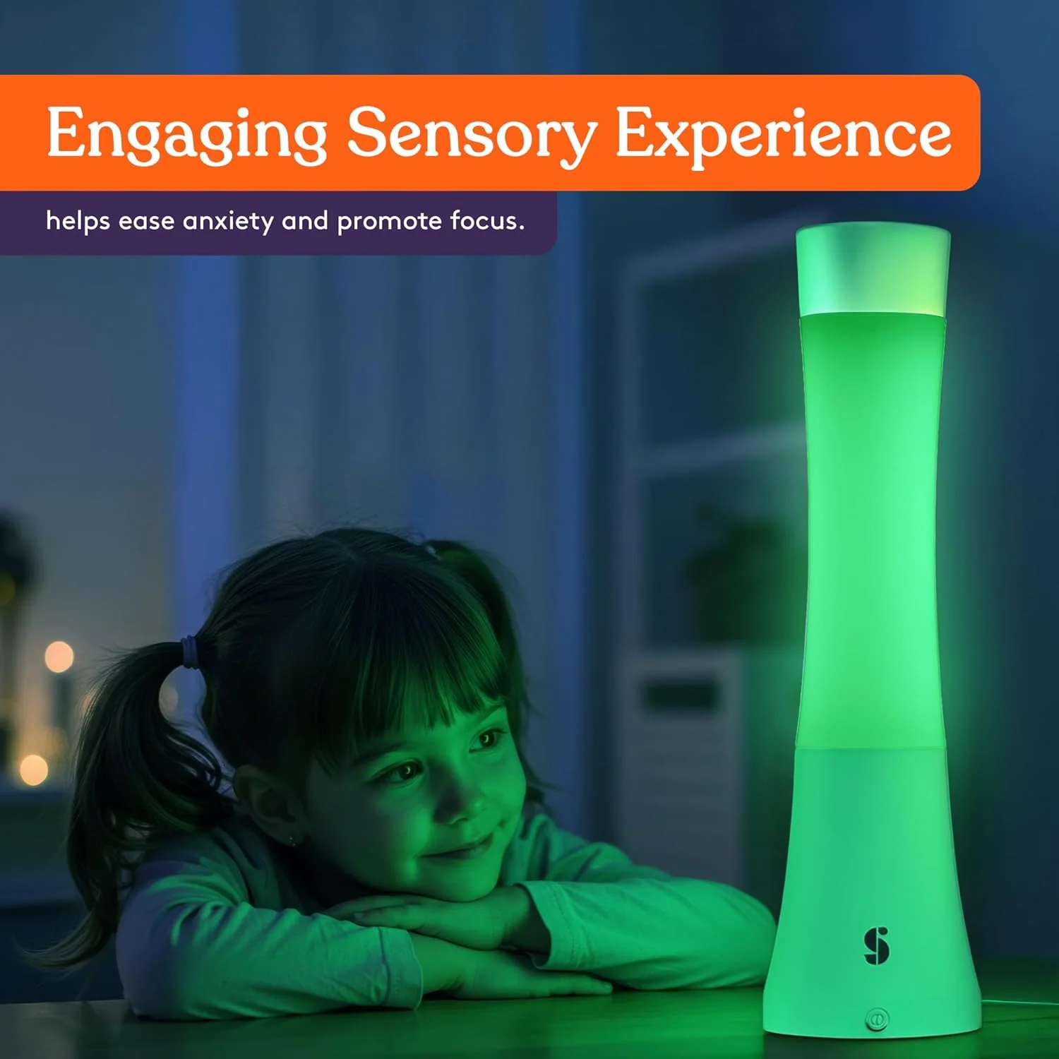 engaging sensory experience, girl looking at green glowing lamp in dark room