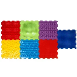 multi colored floor tiles with different textures that connect together like a puzzle