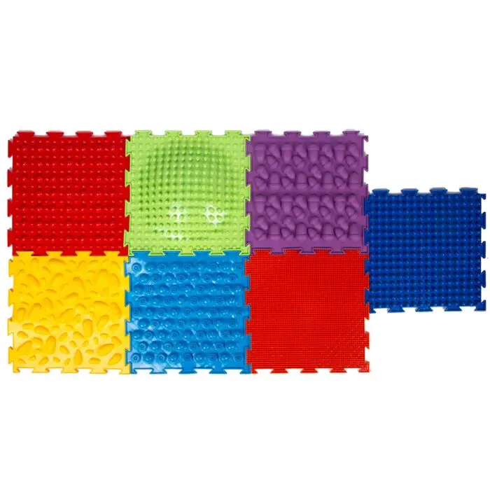 multi colored floor tiles with different textures that connect together like a puzzle