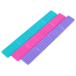 3 bookmark shaped fidgets with textures on the surface in teal, pink and purple