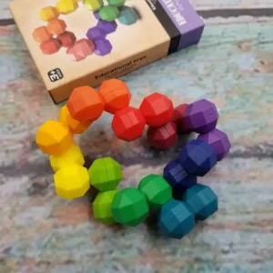 rainbow colored uniformly shaped stones that are connected but can move around