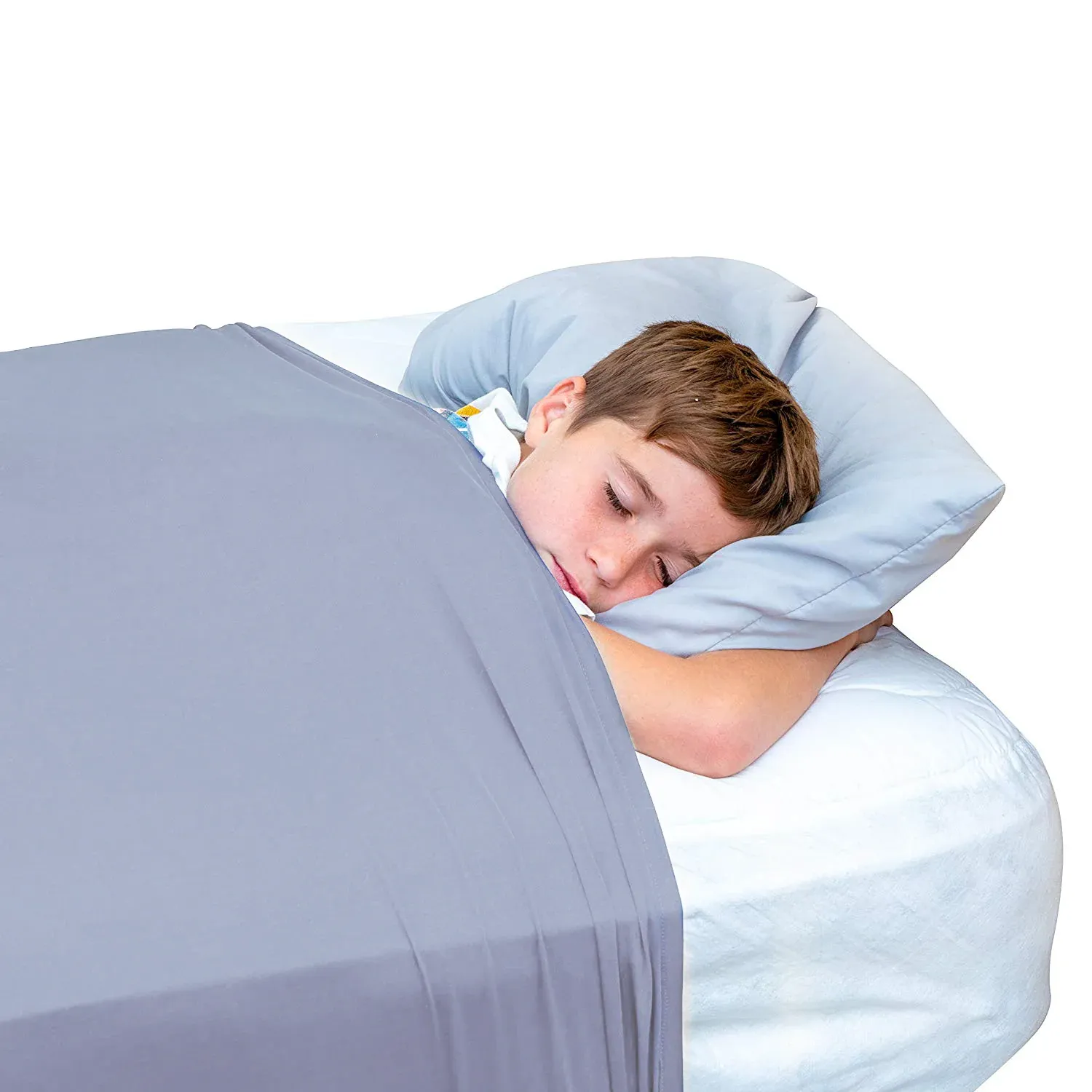 A young boy laying in a mattress with a grey compression sheet wrapped around him and the mattress