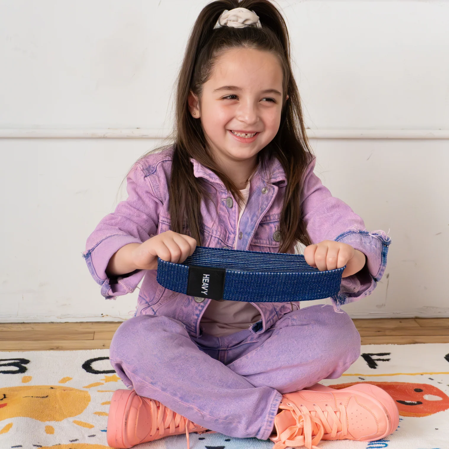 girl holding the blue fidget band