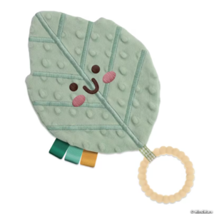 leaf teether has smiley face, ring, ribbon tags and texture