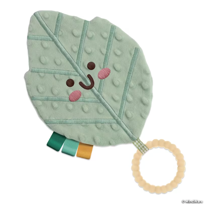 leaf teether has smiley face, ring, ribbon tags and texture