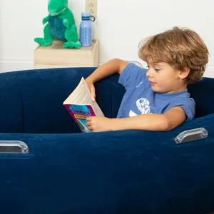 child sitting in middle of pod reading, shows handles on sides