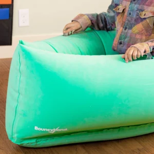 child sitting in middle of canoe shaped pod