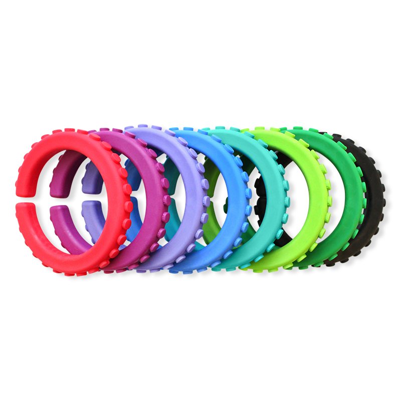 multiple chew bracelets with texture around the outside edge