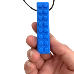blue brick chew with texture dots on top with a black cord