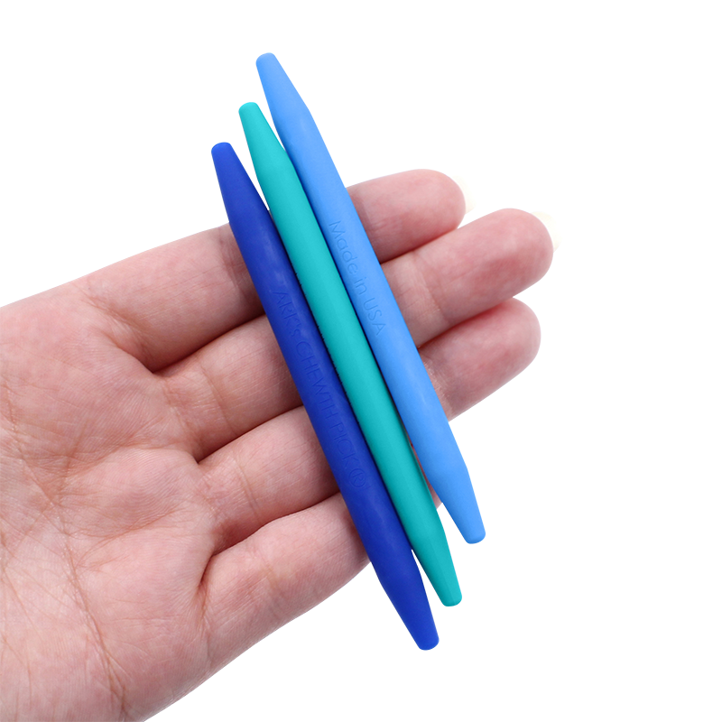 3 blue chewth picks in the palm of a hand