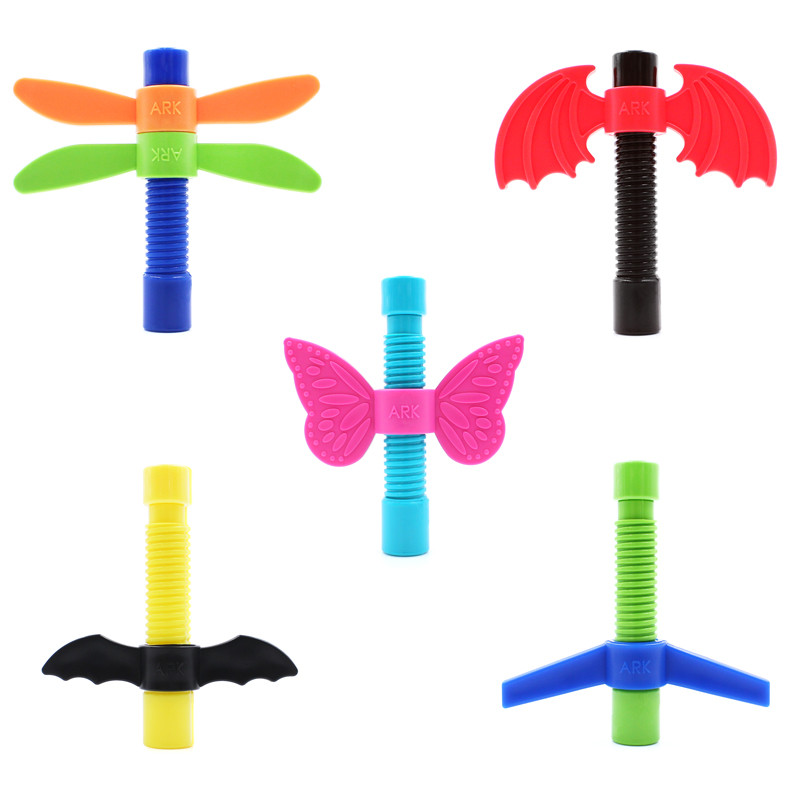 5 multi colored toys with a screw thread that spin