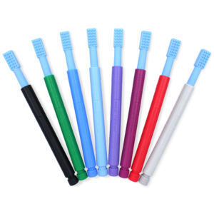 multiple colorways of the vibrating tool, is long like a toothbrush and has a head with textured dots