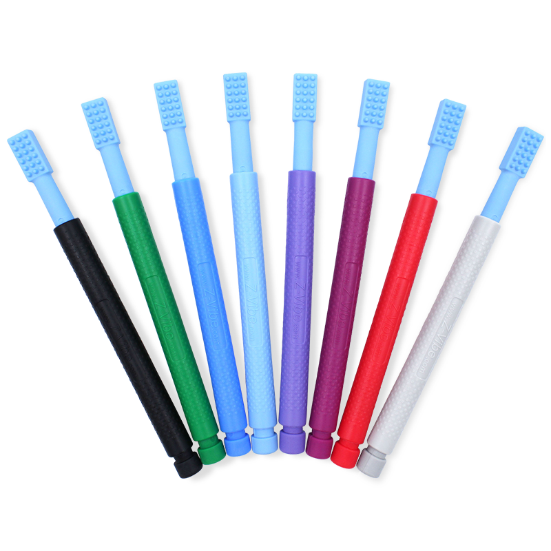 multiple colorways of the vibrating tool, is long like a toothbrush and has a head with textured dots