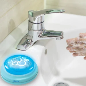 timer on the ledge of a sink with someone washing their hands