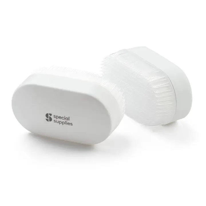 pair of white oval brushes with white bristles