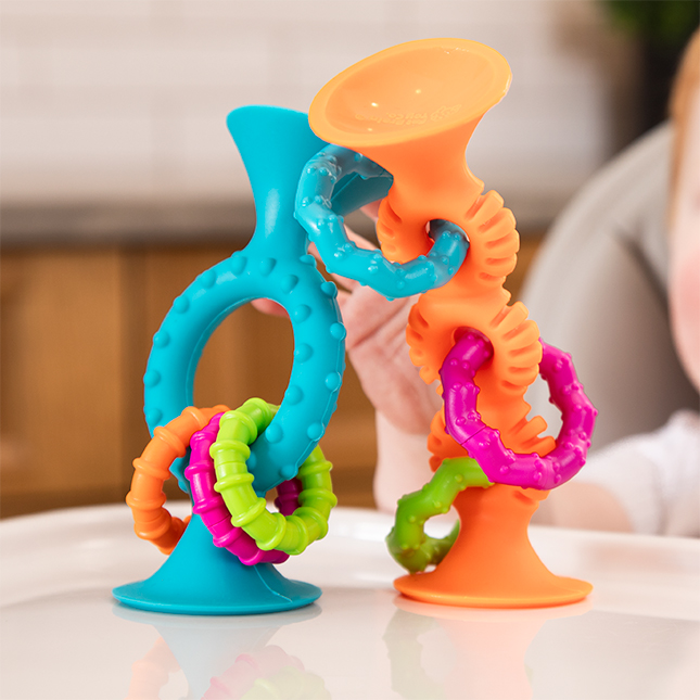two toys with suction cup ends and multiple loops and multi colored rings