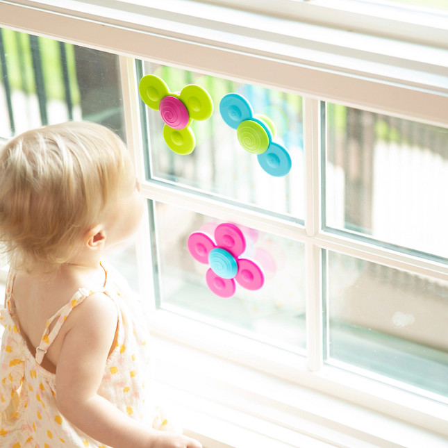 spinners suctioned to a window