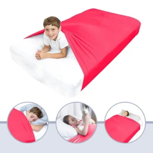 A young boy laying in a mattress with a red compression sheet wrapped around him and the mattress