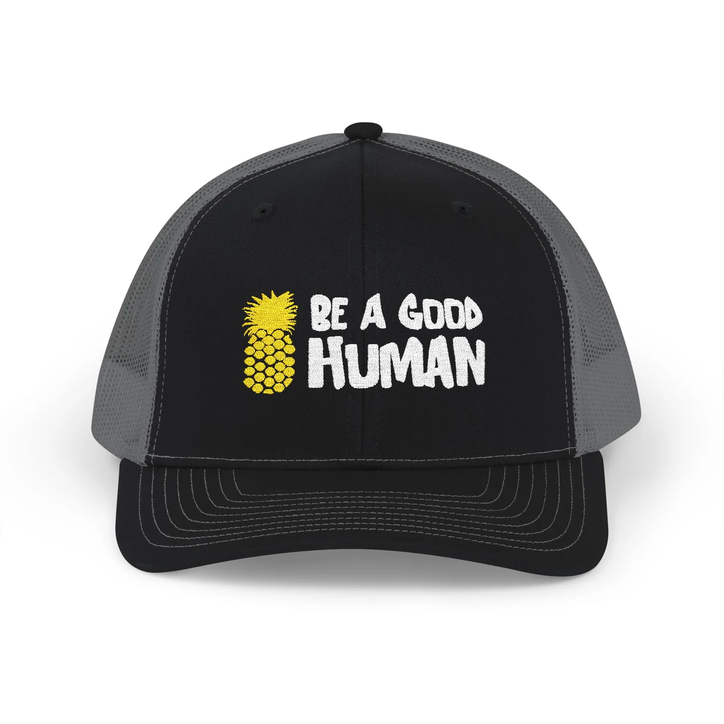 black hat with grey mesh that says "be a good human" in white with a yellow pineapple