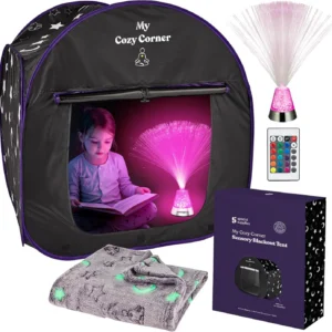 girl in a cube shaped black out tent with a pink light reading a book