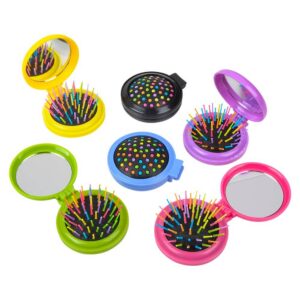 different colored brushes that pop into a case with a mirror
