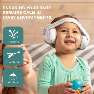 baby wearing safety earmuffs smiling