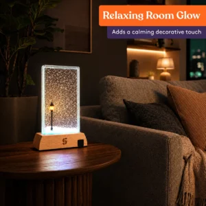 dark room with the lamp on a side table, glowing