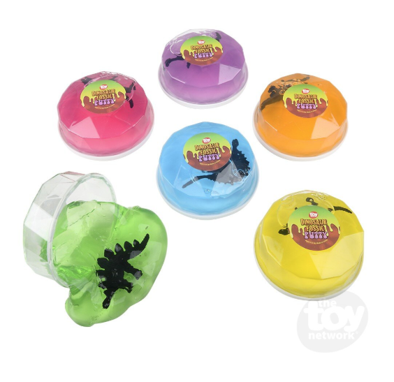 faceted clear plastic container with colored slime inside and a plastic dinosaur