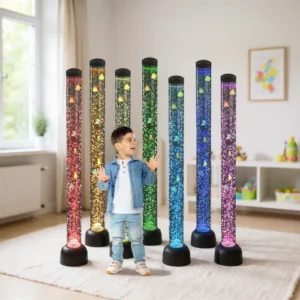 toddler standing in front of lit-up tubes with fake fish inside