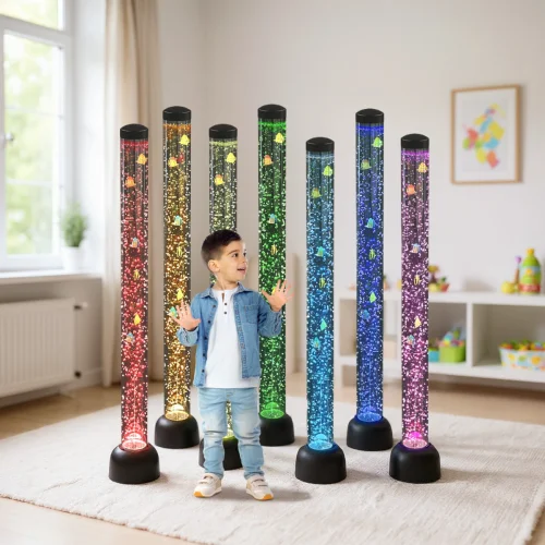 toddler standing in front of lit-up tubes with fake fish inside