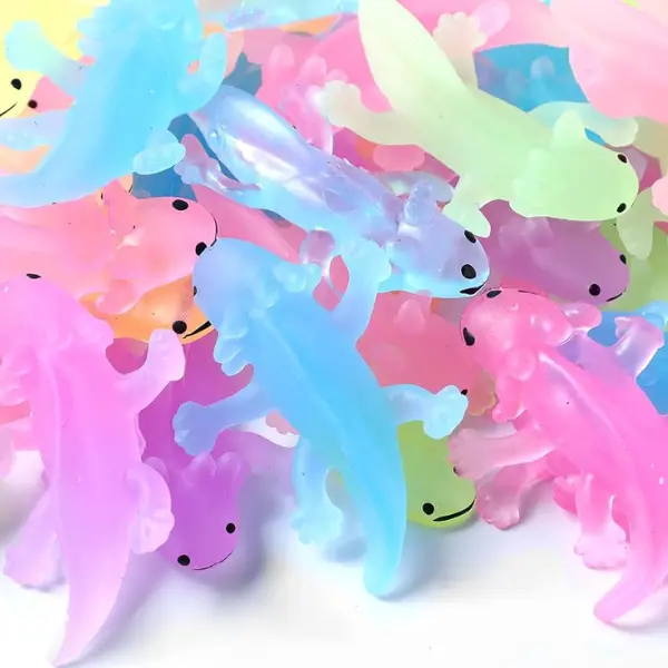 a pile of mini axolotl toys in various pastel colors
