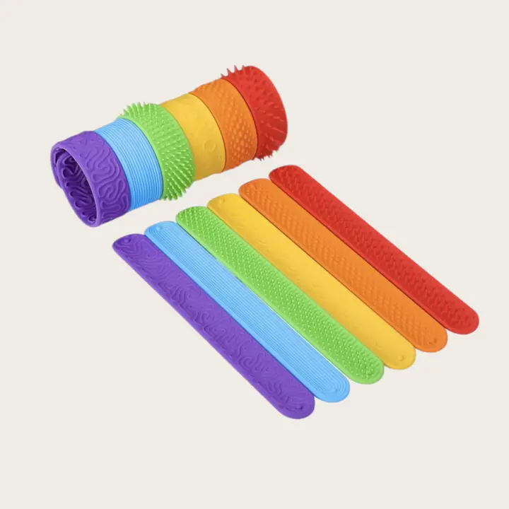 slap bracelets in purple, blue, green, yellow, orange and red with different textures on each one