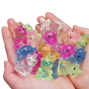 two open hands holding many mini unicorn squishies that are different colors