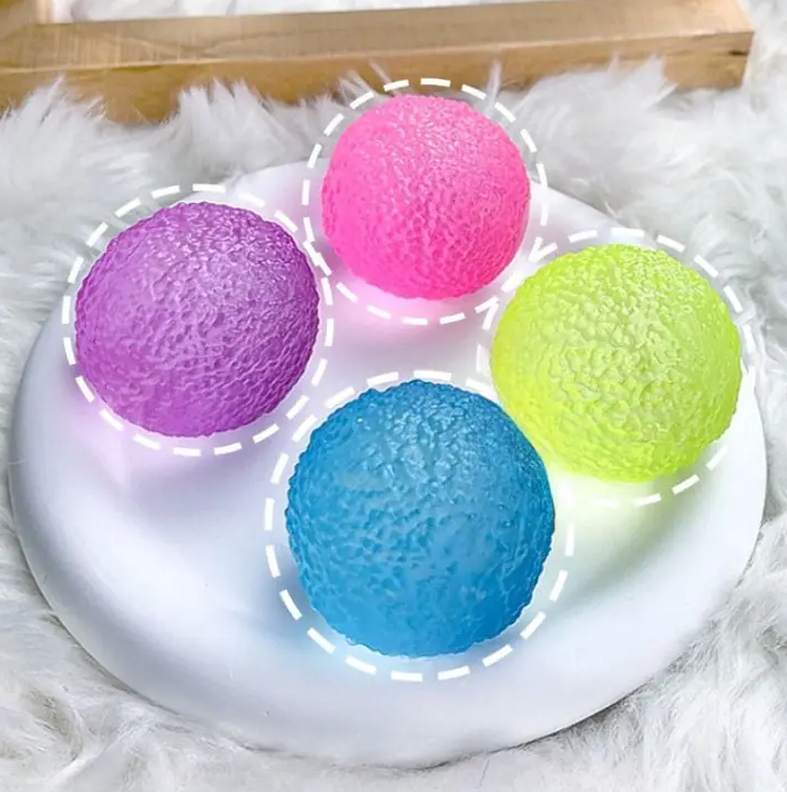 textured squish toys in purple, pink, green and blue